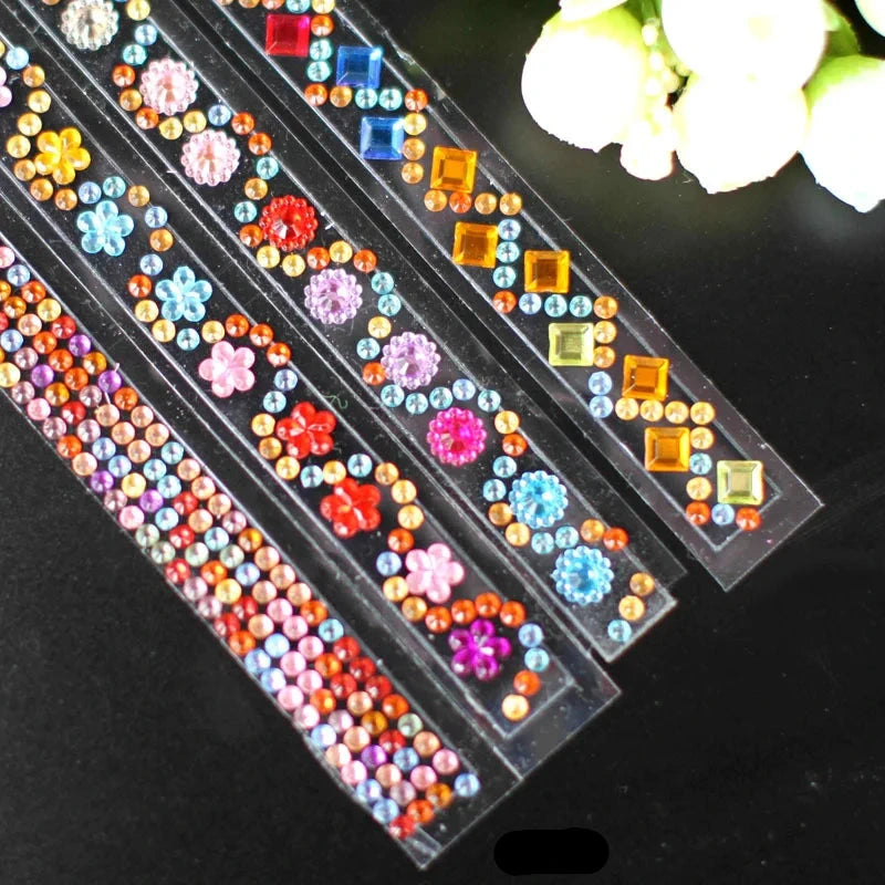 Decorative rhinestone strips with colorful stones on a black background