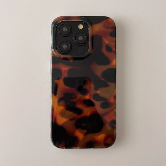 Tortoiseshell patterned phone case on a light gray background