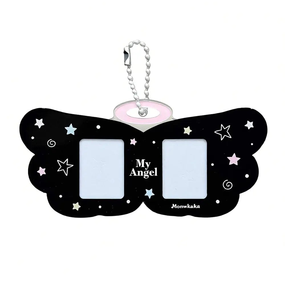 Black butterfly-shaped keychain with 'My Angel' text and star designs on a white background