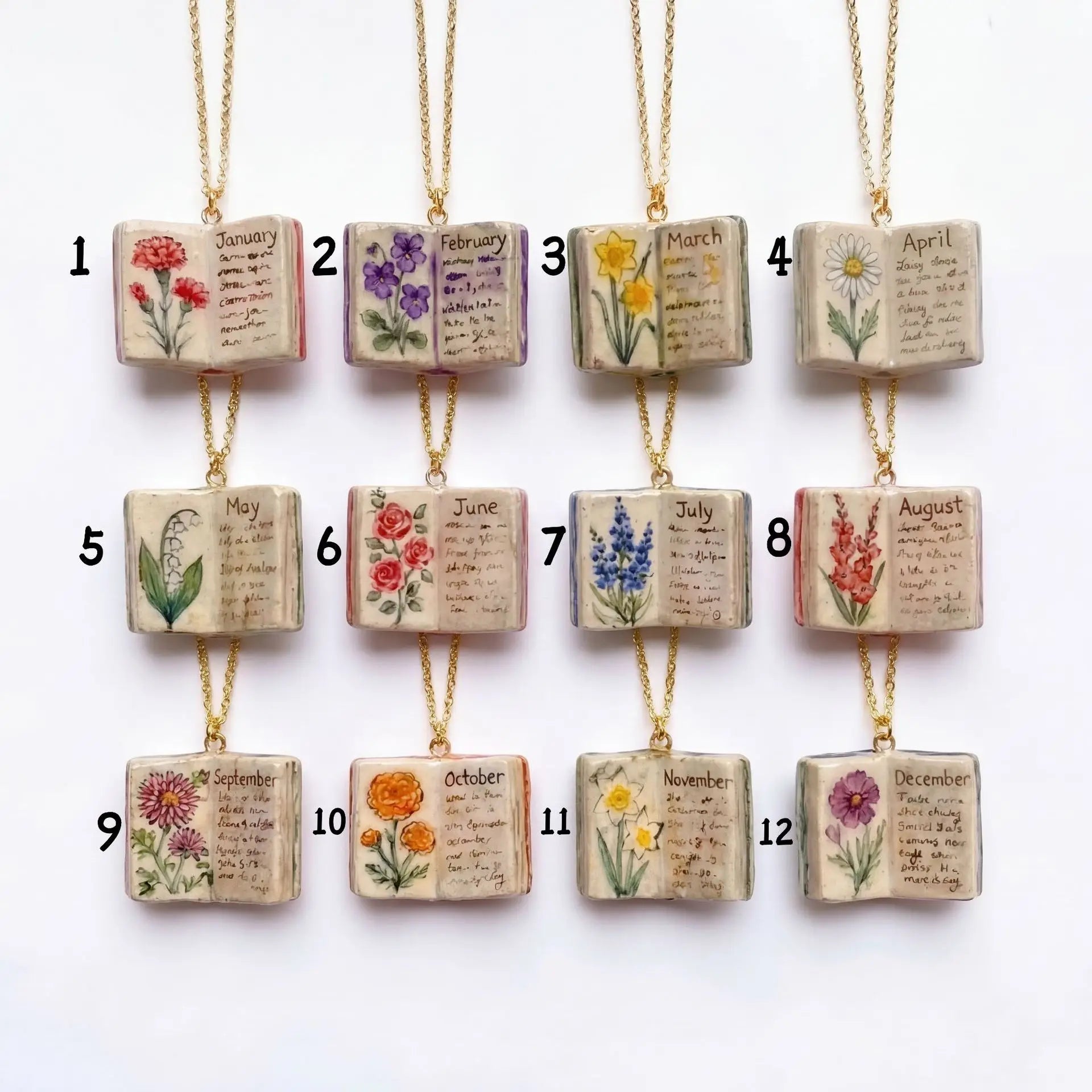 Decorative wooden blocks with floral designs and months listed, hanging on strings against a white background.