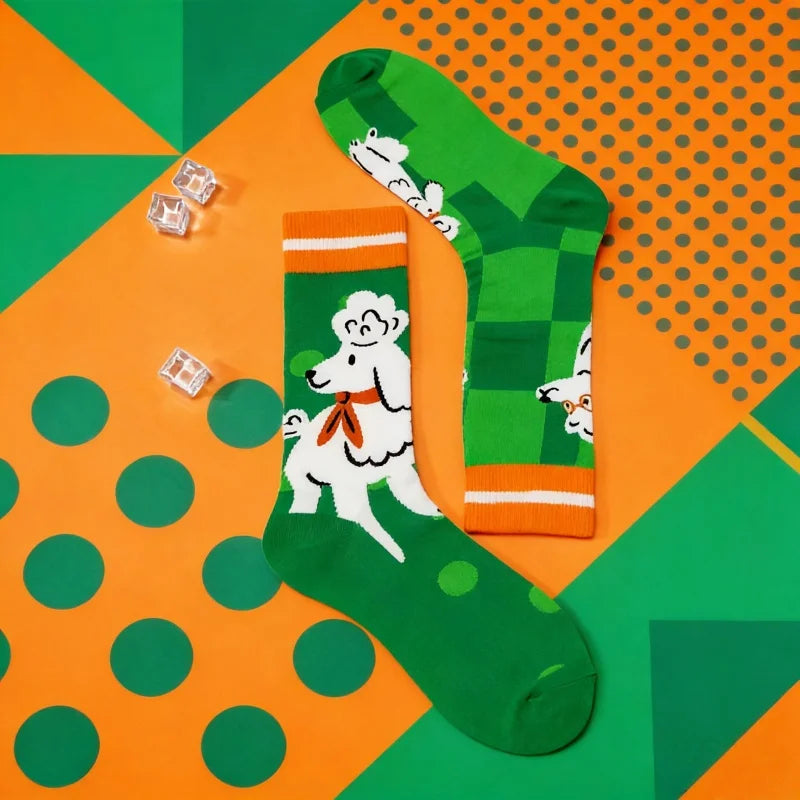 Green socks with white dog design on a colorful geometric background