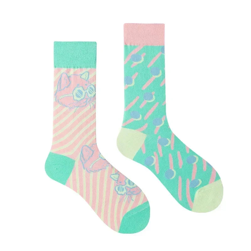 Colorful socks with cat designs on a white background