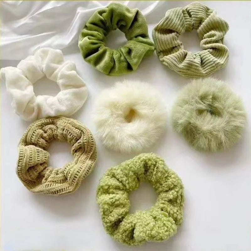 Collection of various scrunchies on a white background