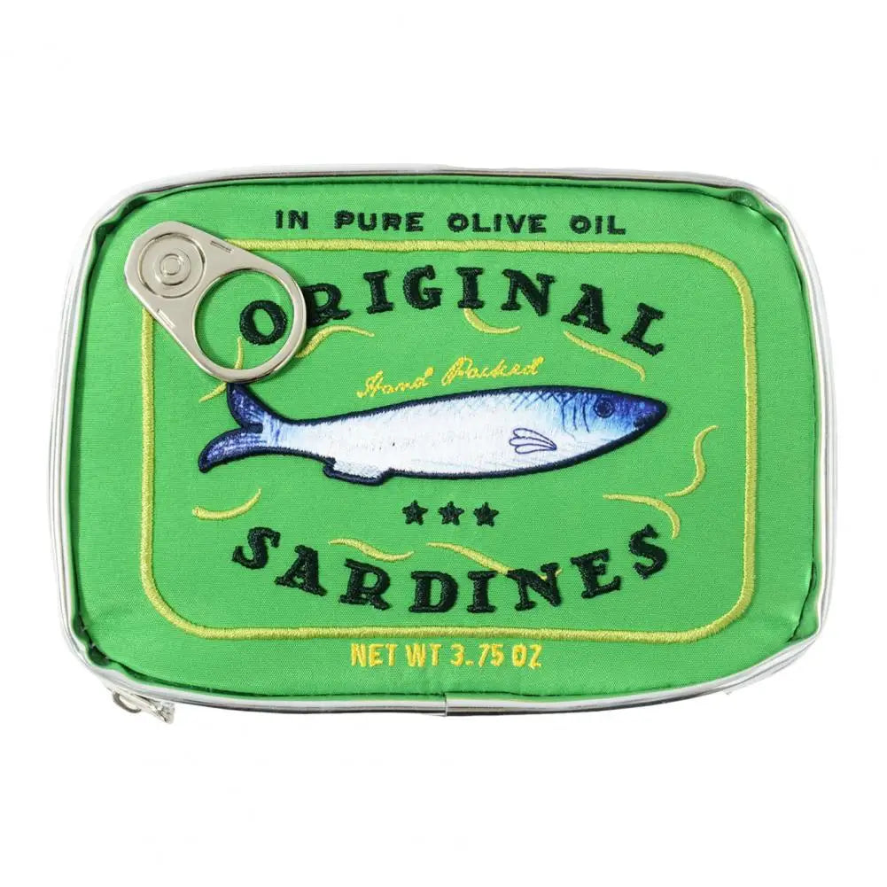 A novelty zippered pouch designed to look like a green sardine can, featuring a silver pull tab, embroidered fish graphic, and text reading 'Original Sardines' and 'In Pure Olive Oil'.