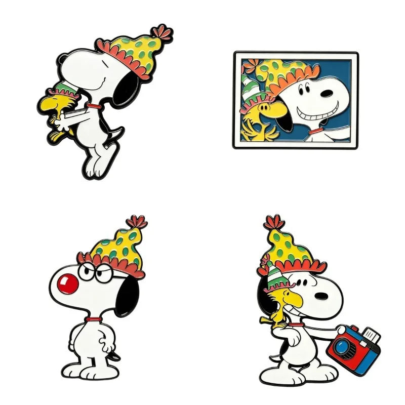 Four cartoon enamel pin designs featuring Snoopy and Woodstock in birthday multicolor hats, shown on a plain white background.