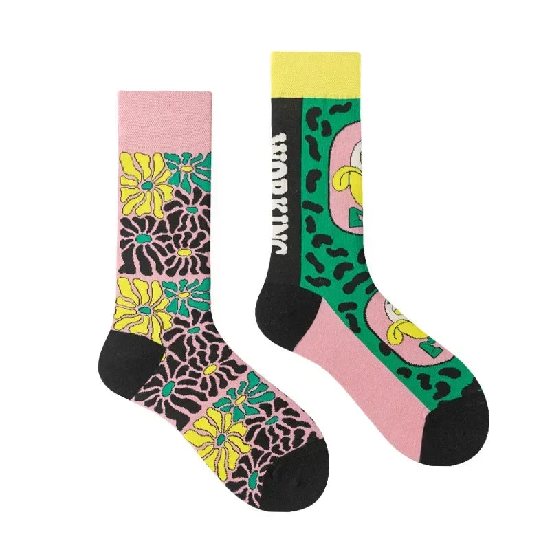 Two colorful socks with floral and abstract patterns on a white background