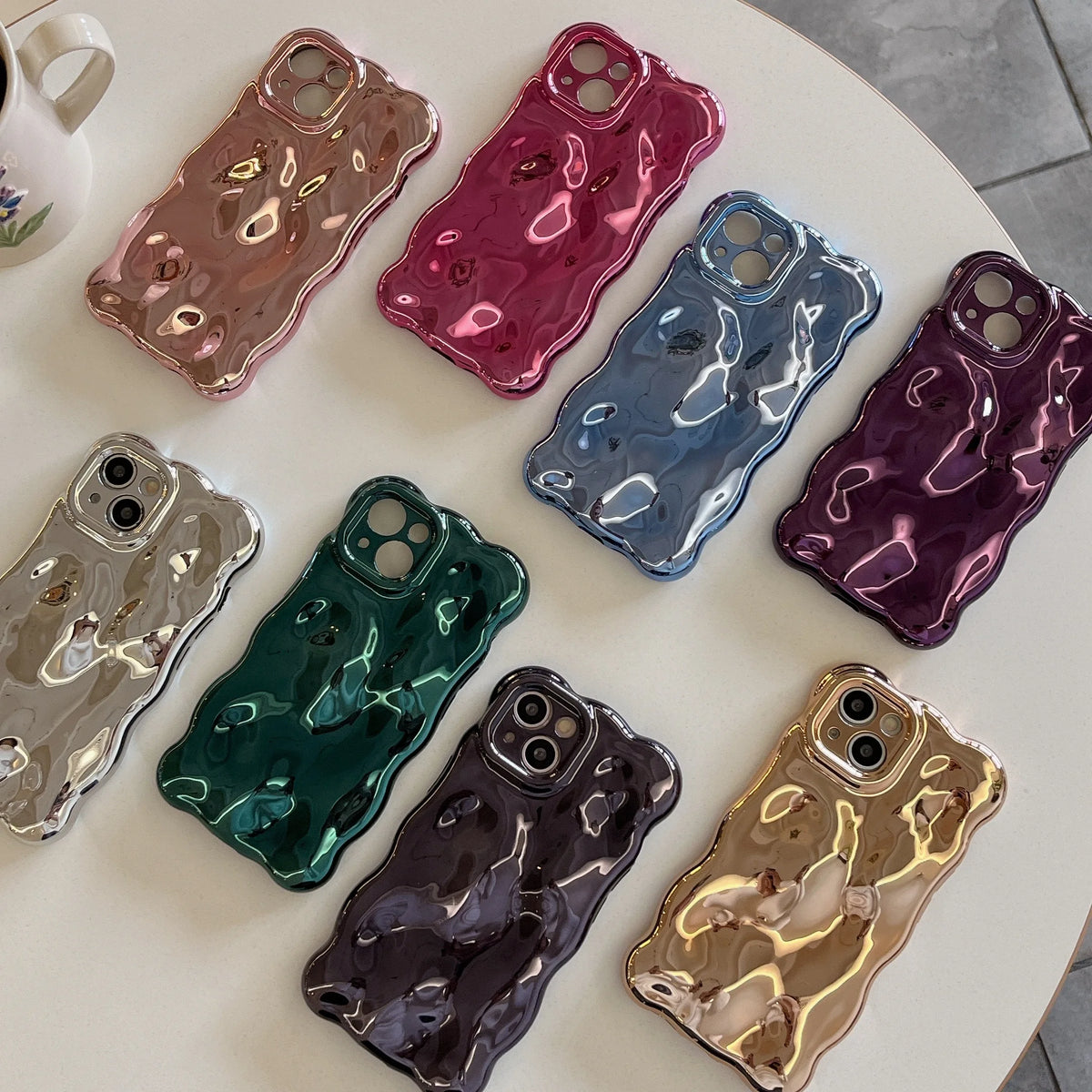 Collection of colorful phone cases on a light surface