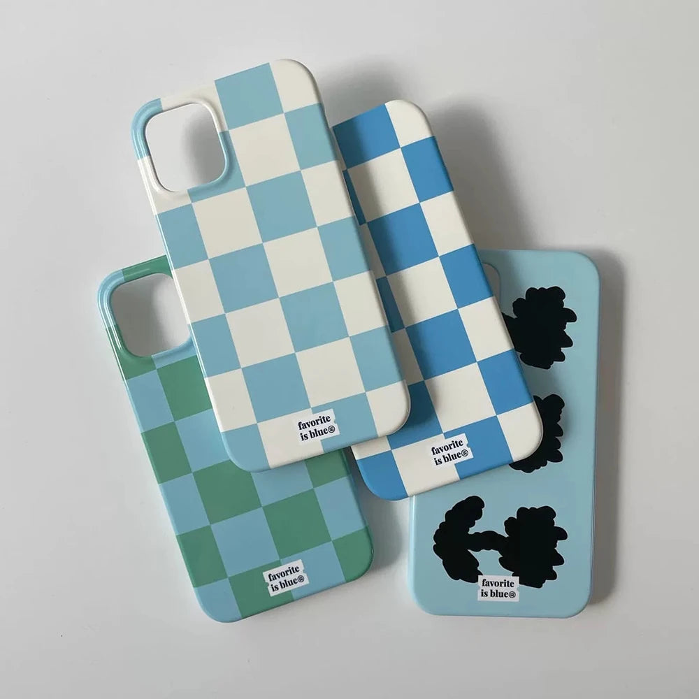 Four phone cases arranged on a light gray background. Two cases feature a blue and white checkerboard pattern, one features a green and blue checkerboard pattern, and one is light blue with black abstract shapes.