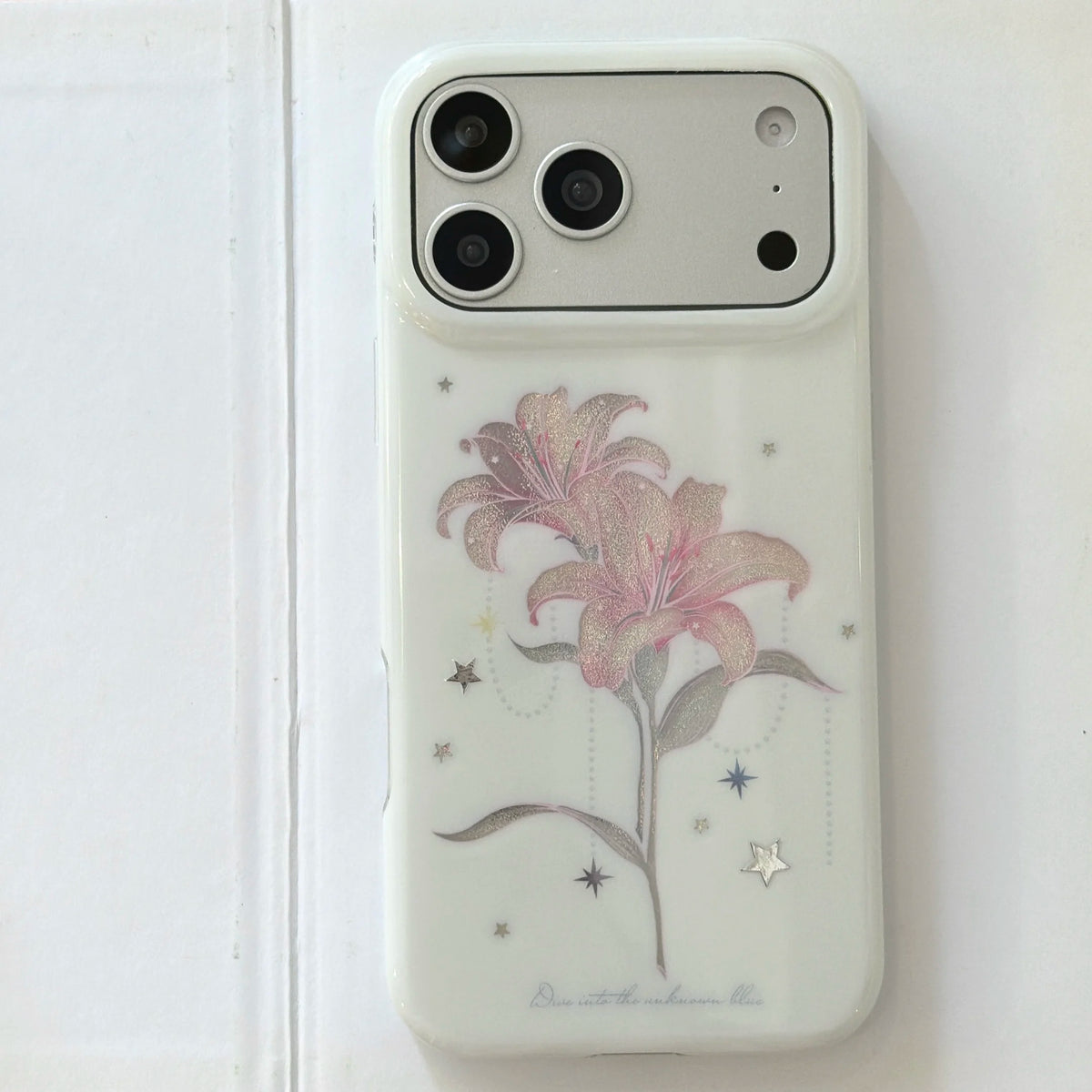 Phone case with pink flower design on a white background