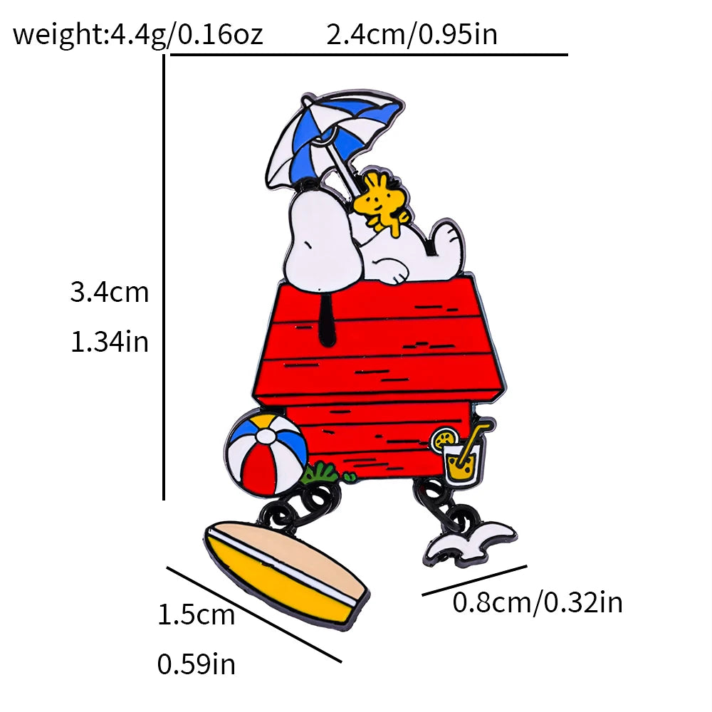 A cartoon enamel pin of Snoopy in his red doghouse with Woodstock, an umbrella, beach ball, and drink, shown with dimension lines and text indicating weight, height, width, and depth on a white background.