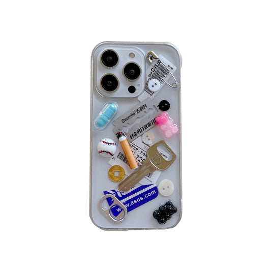 Phone case with various charms on a white background