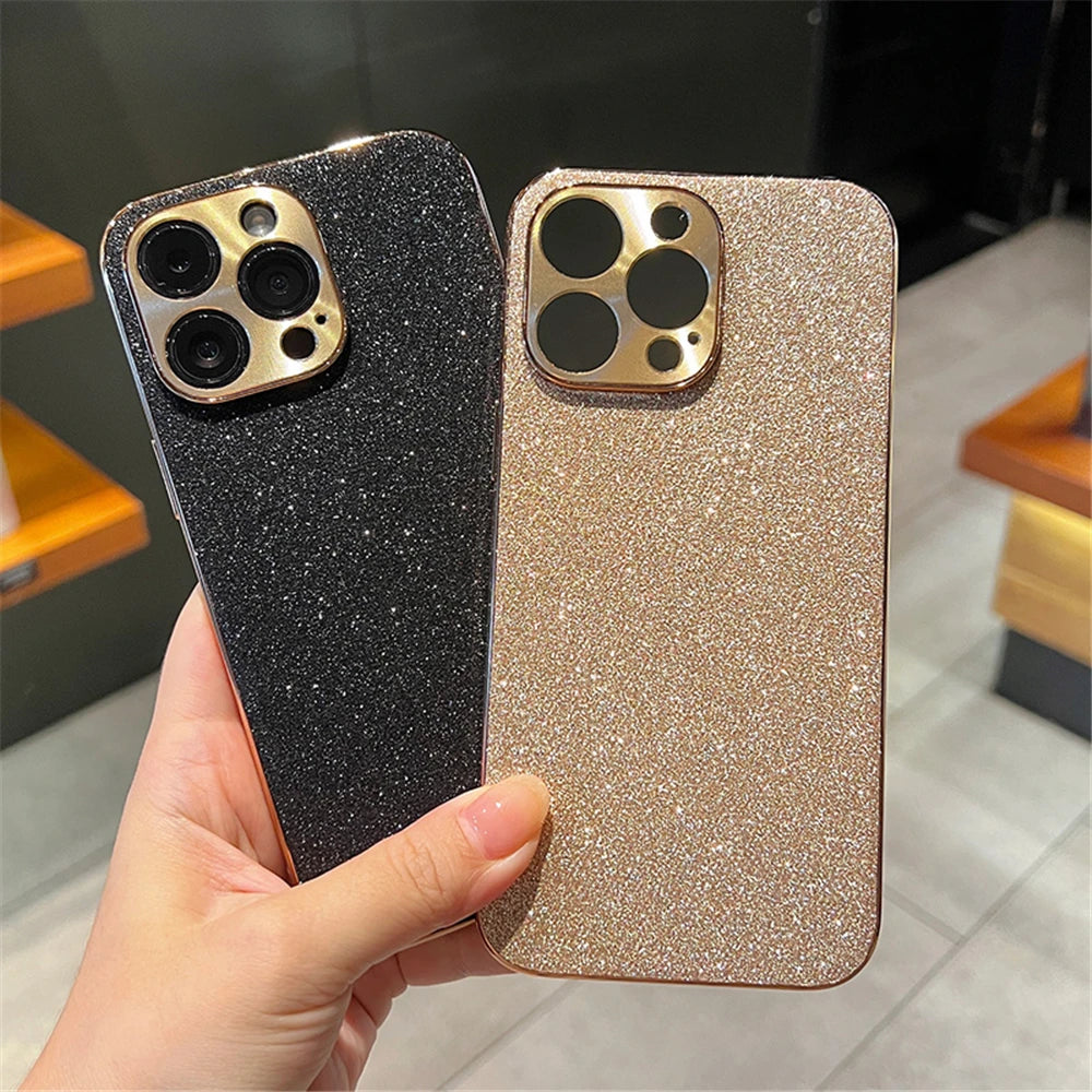Two glittery phone cases, one black and one gold, held by a hand.