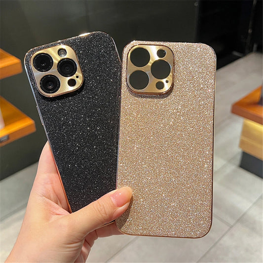 Two glittery phone cases, one black and one gold, held by a hand.
