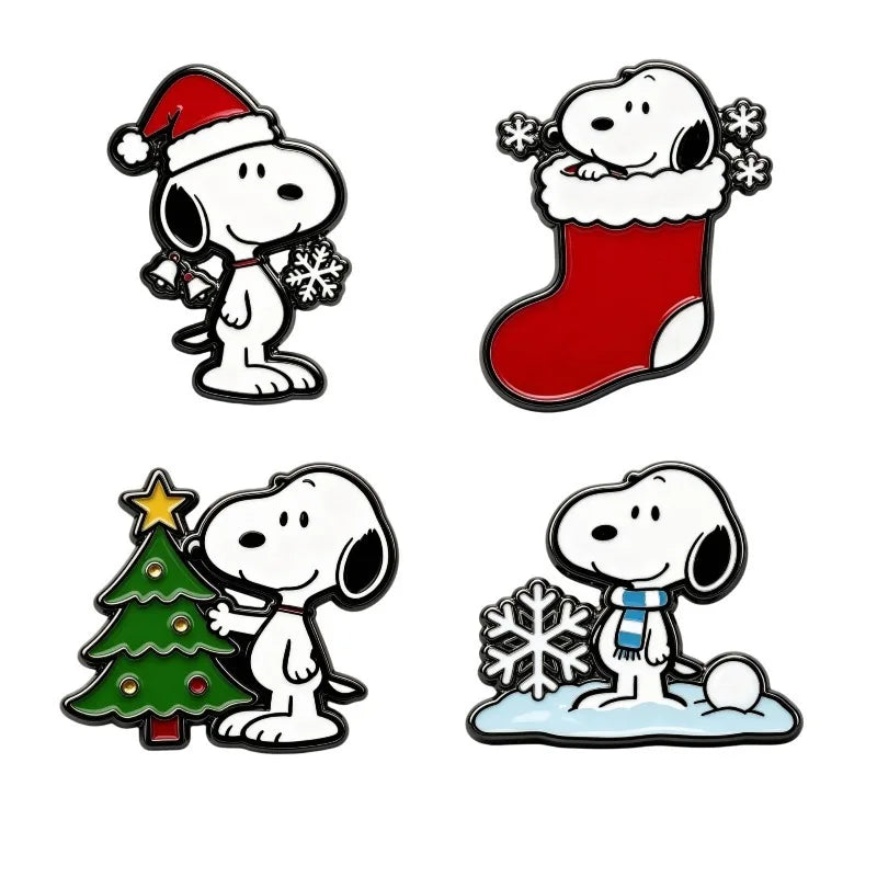 Four Snoopy holiday enamel pins on a white background: Snoopy in a Santa hat with a bell, Snoopy in a red stocking, Snoopy by a Christmas tree, and Snoopy with a snowflake and scarf.