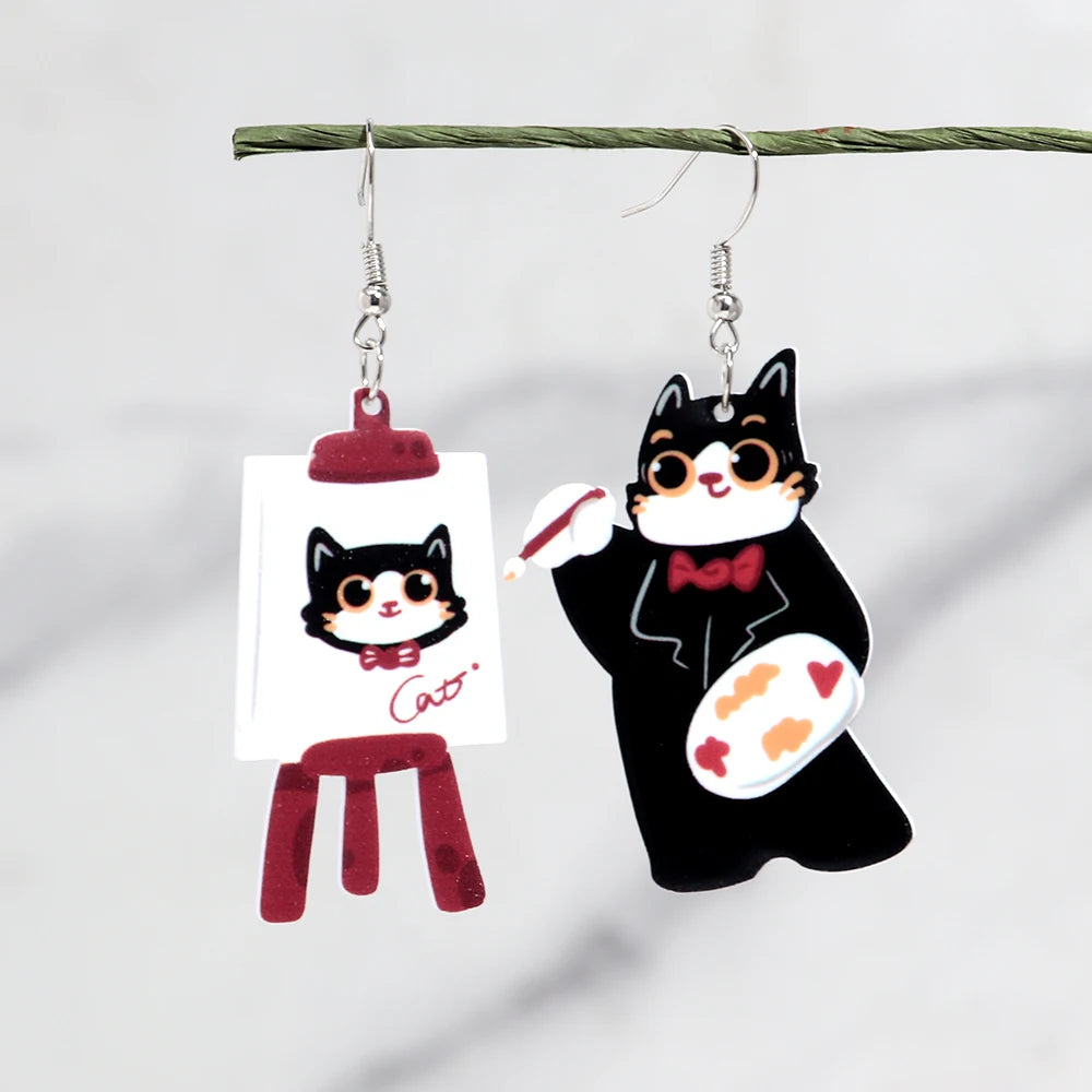Cat-themed earrings on a white background