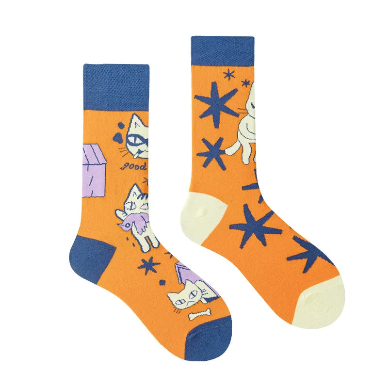 Pair of socks with cat illustrations on an orange background