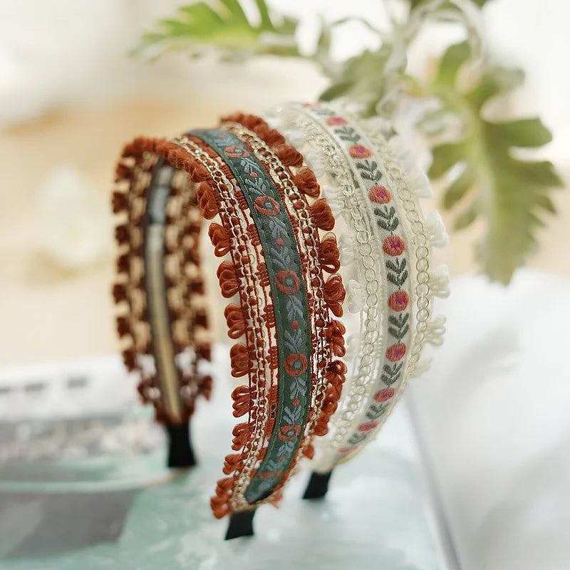 Set of decorative headbands with intricate patterns on a blurred background