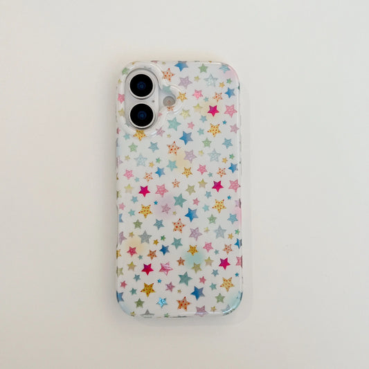 A clear phone case with a colorful pattern of small stars in pink, blue, yellow, and green on a white background, shown on a phone against a plain white surface.