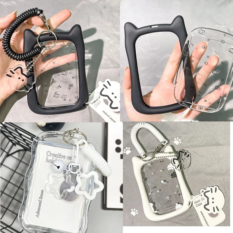 A four-panel collage showing a cat-ear photo card holder  in different colorways: black with a clear panel, clear with a black panel, clear with a white panel, and white with a clear panel. Each view shows the case being held in a hand, with a coiled wrist strap and a small cat-shaped charm attached.