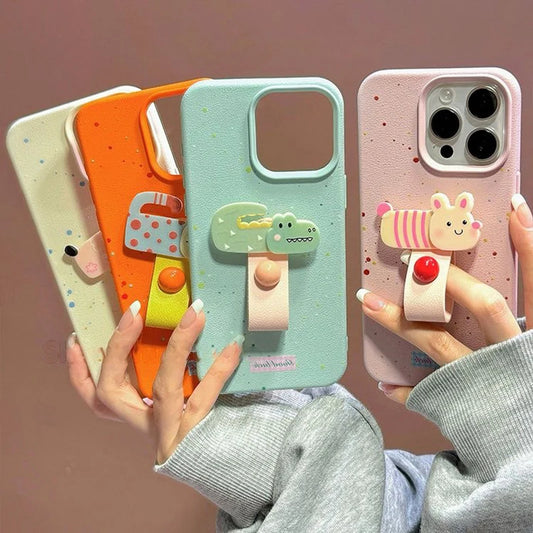 Four colorful phone cases with stand and clip attachments held by a person.