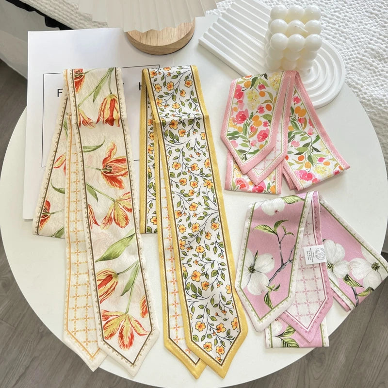 Set of floral patterned scarves on a white surface