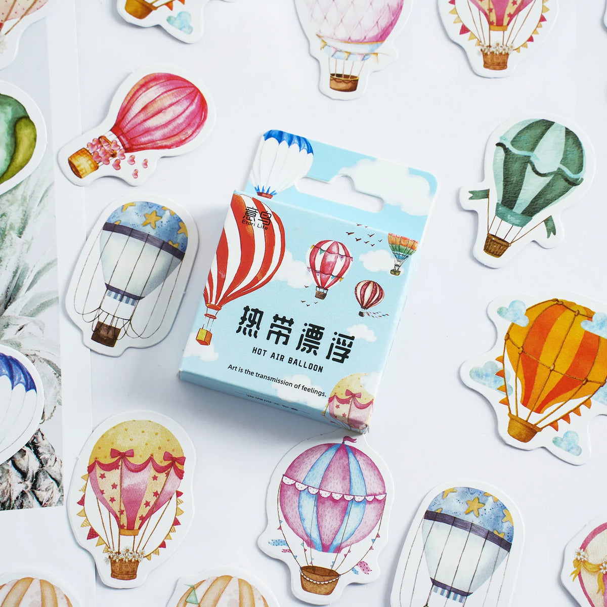 A package of hot air balloon stickers is shown in the center, surrounded by several loose, individually cut hot air balloon stickers on a white background.