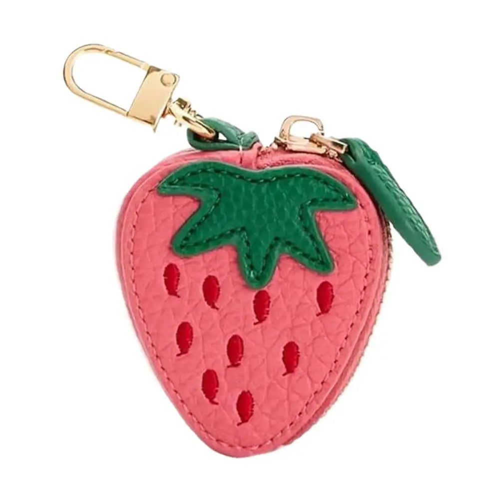 Strawberry-shaped keychain with green leaf on a white background