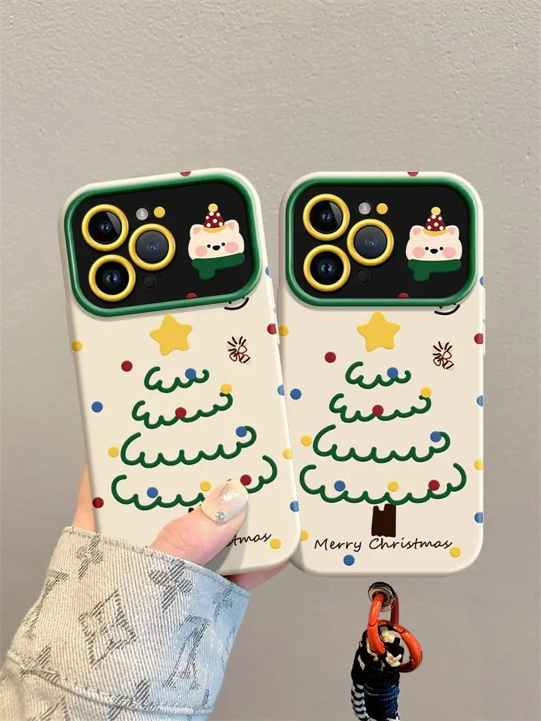 Phone case with Christmas tree design held by a hand against a gray background
