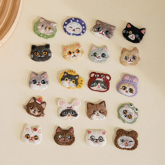 Collection of cat-themed patches on a beige background
