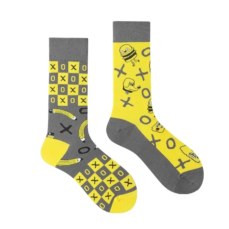 Two socks with a checkered pattern and cartoon bee design on a white background