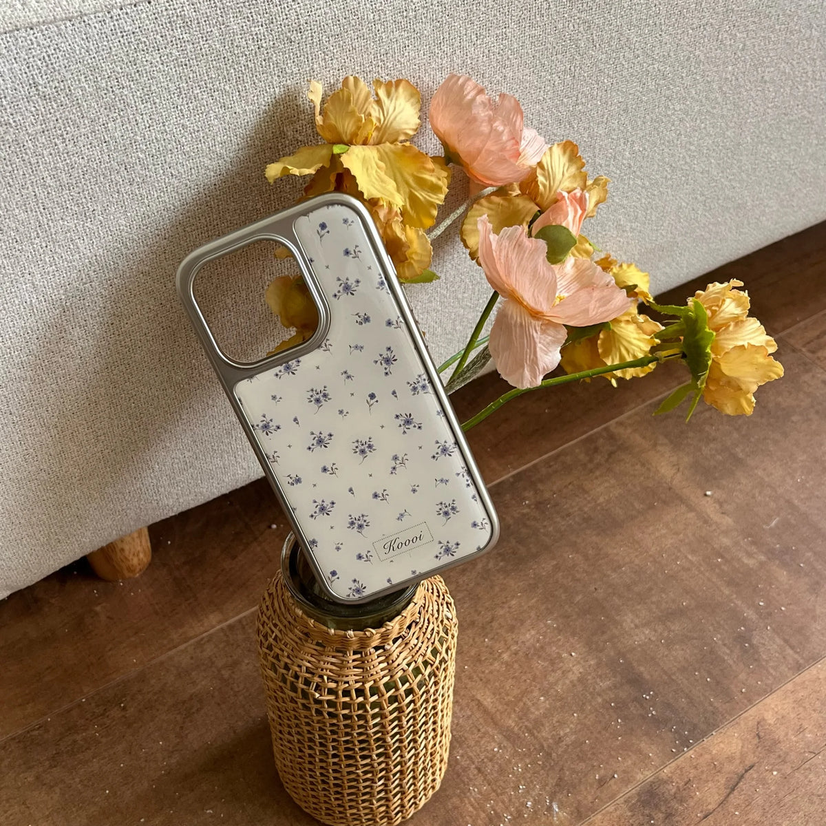 Phone case with floral pattern on a vase with flowers