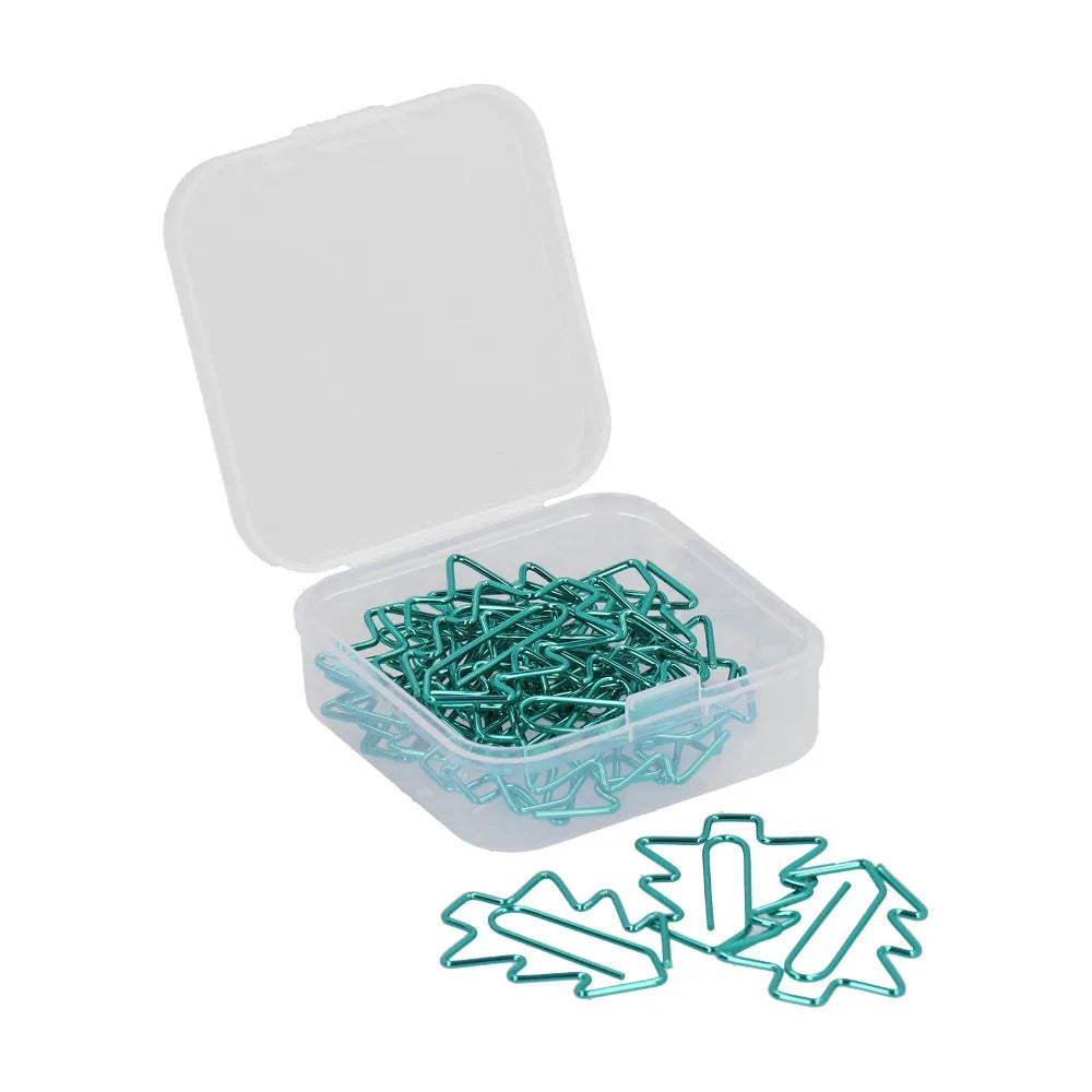 A clear plastic storage container with an open lid, filled with metallic teal paperclips, with three more teal paperclips placed in front on a white background.