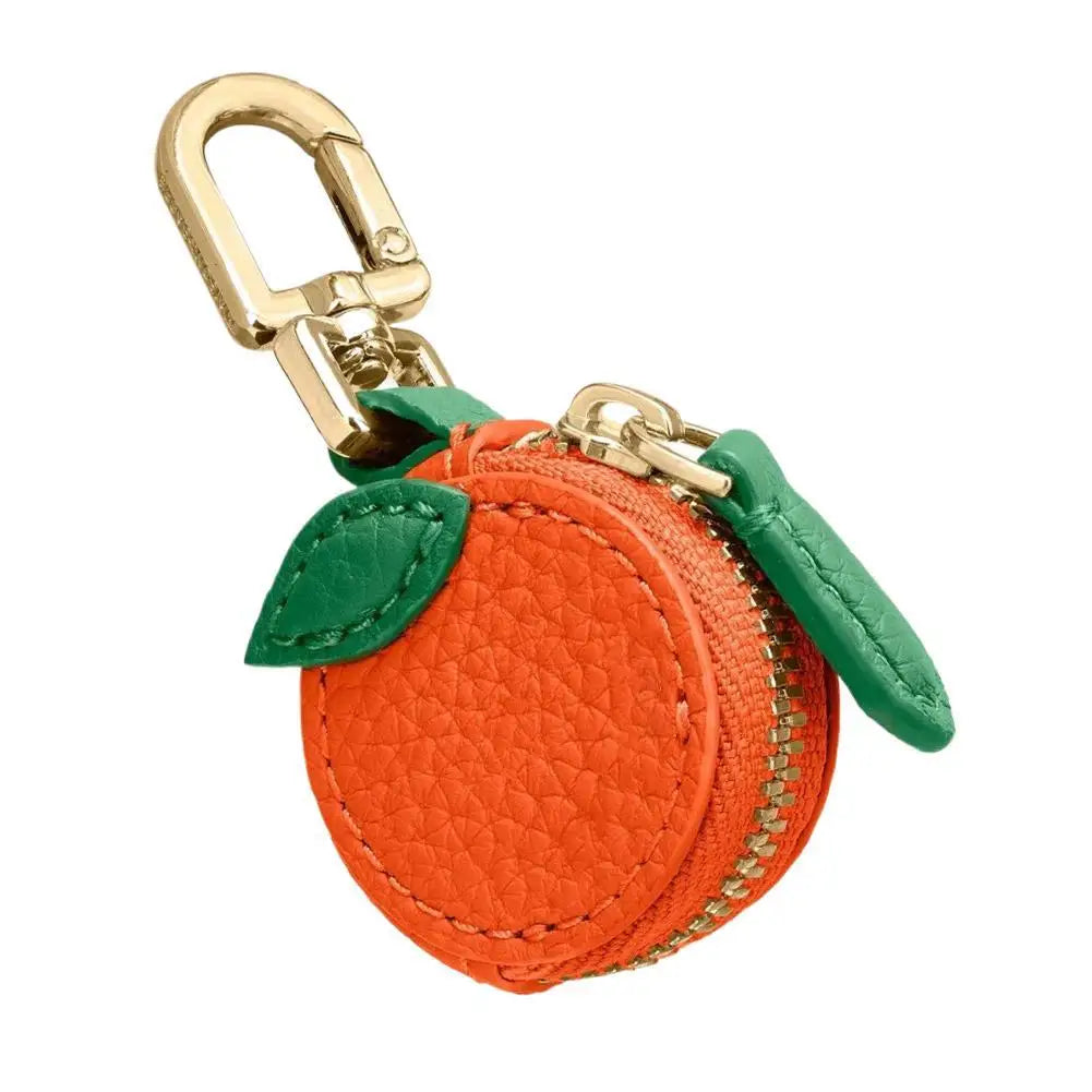 Orange fruit-shaped keychain with a gold carabiner on a white background