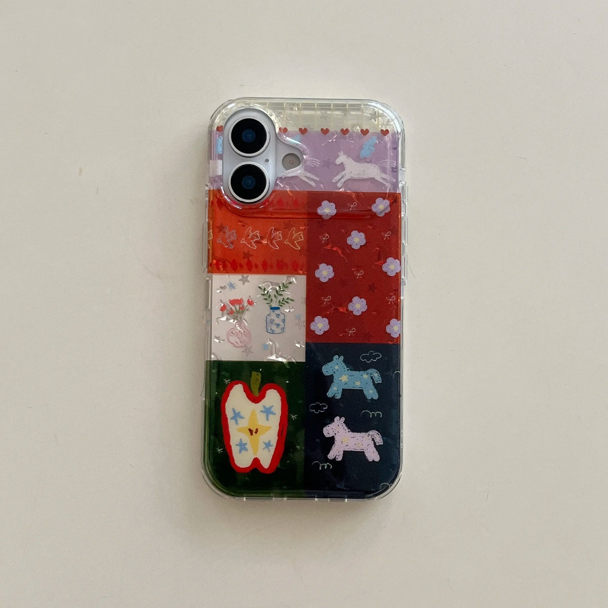 Phone case with colorful designs on a light gray background