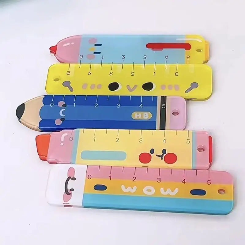 Colorful pencil-shaped rulers with cartoon face on a white background