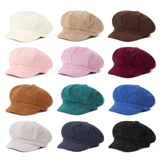 Twelve corduroy newsboy caps arranged in a 3x4 grid on a white background, showing multiple color options including cream, tan, brown, pink, burgundy, mustard, teal, royal blue, light gray, navy, and black.