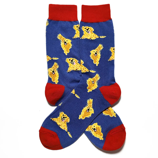 Blue socks with yellow dog pattern and red accents on a white background
