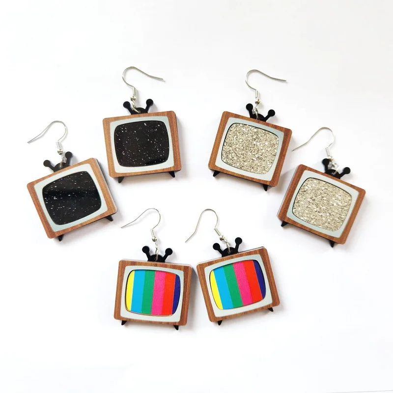 Set of TV-shaped earrings with different designs on a white background
