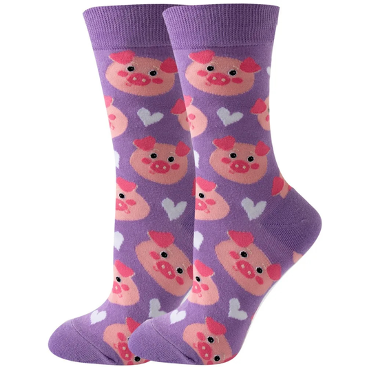 Purple socks with pink pig pattern on a purple background