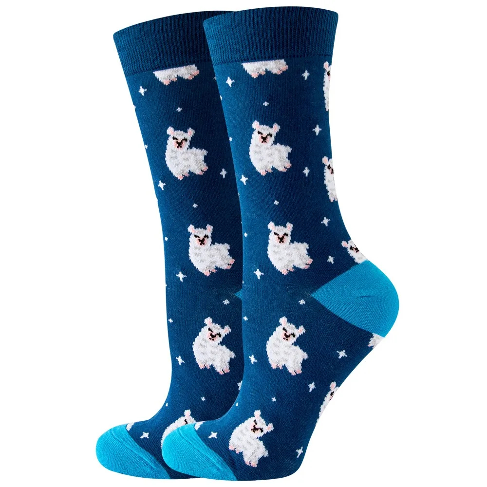 Pair of blue socks with white alpaca illustrations on a white background