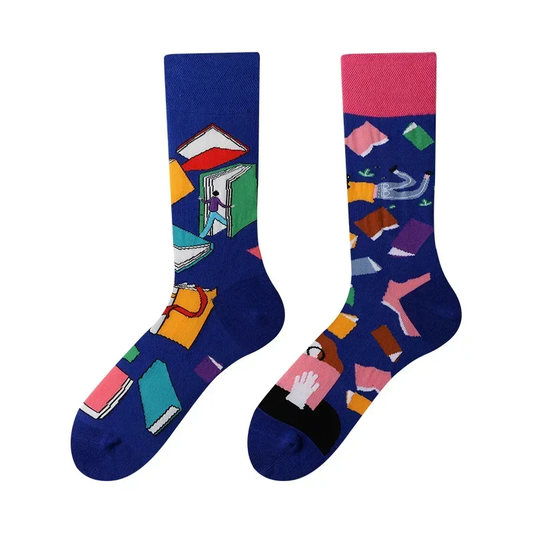 Colorful socks with abstract book designs on a white background
