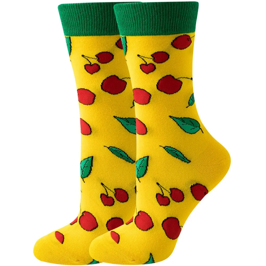 Yellow socks with red cherries and green leaves on a white background