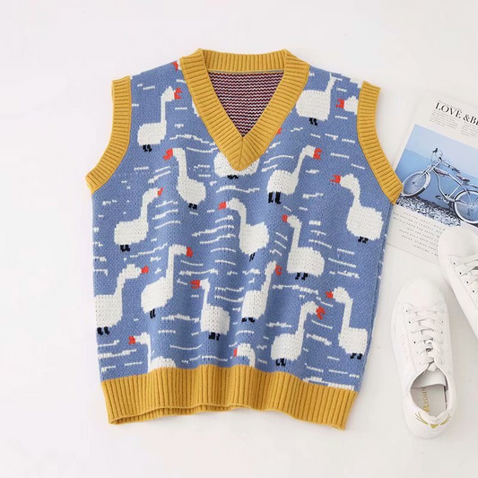 A blue sweater vest with an allover goose pattern, featuring a V-neck and a yellow crew neckline.